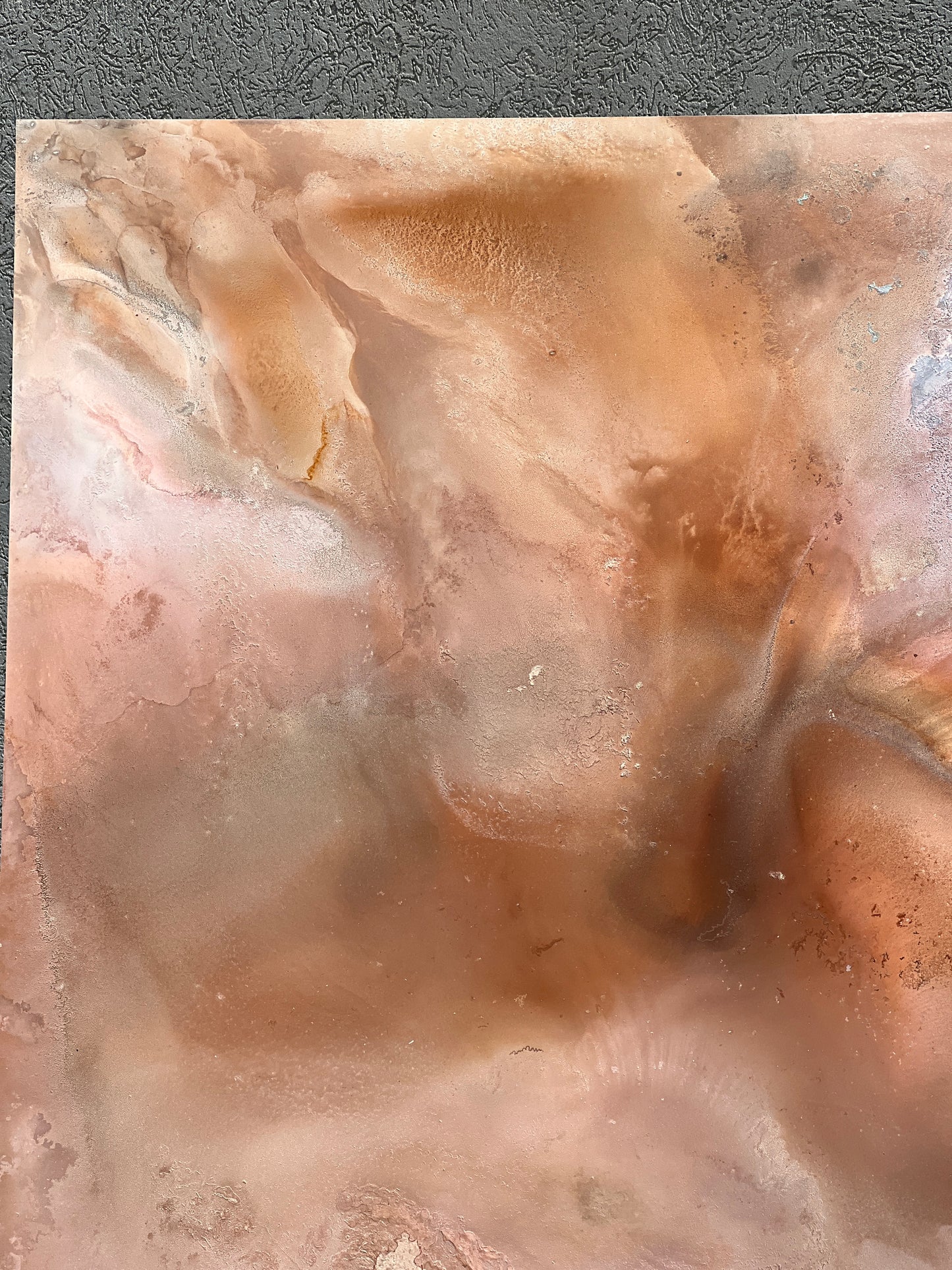 Close-up of a textured stone surface with brown and beige colors